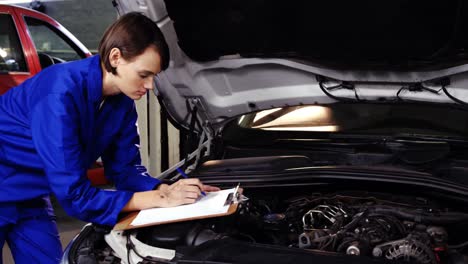 Female-mechanic-preparing-a-check-list