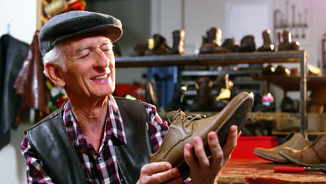 Shoemaker-examining-a-shoe