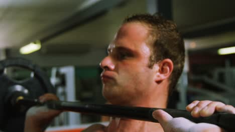Muscular-man-lifting-barbell