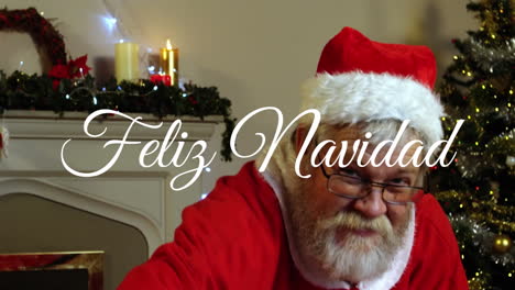 Animation-of-feliz-navidad-text-over-santa-claus-at-christmas