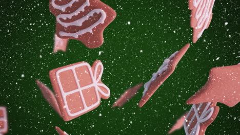 Animation-of-christmas-gingerbread-cookies-over-snowflakes-falling-on-green-background