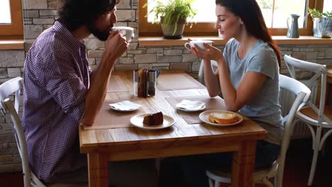 Couple-having-coffee-in-cafe