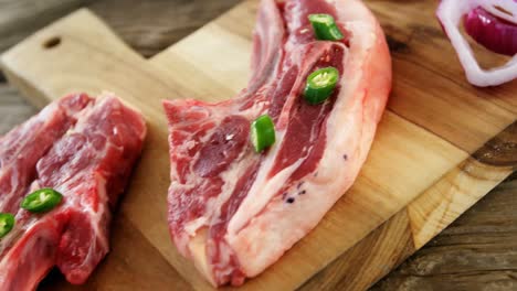 Raw-steak-and-ingredients-on-chopping-board