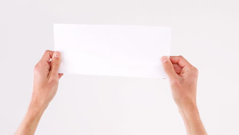 Man-hand-holding-white-blank-paper