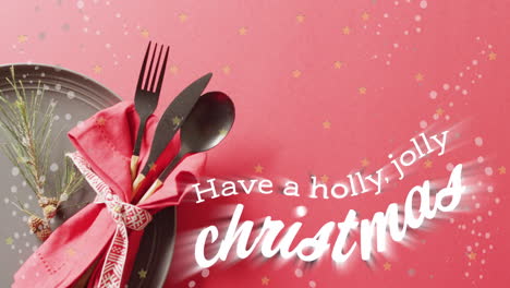 Animation-of-christmas-greetings-text-over-christmas-place-setting-and-decorations