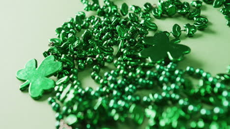 Video-of-st-patrick's-green-shamrock-and-necklace-on-green-background