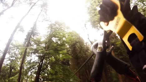 Man-on-zip-line-in-forest