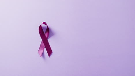 Video-of-purple-add-or-adhd-awareness-ribbon-on-purple-background-with-copy-space