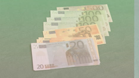 Animation-of-close-up-of-euro-bills-falling-against-green-background