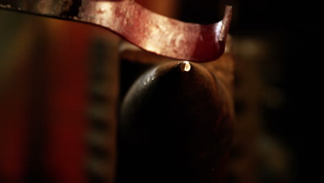 Close-up-of-blacksmith-working-on-a-iron-rod