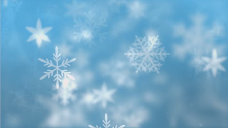 Schneeflocken-Bewegen-Sich-Vor-Blauem-Hintergrund