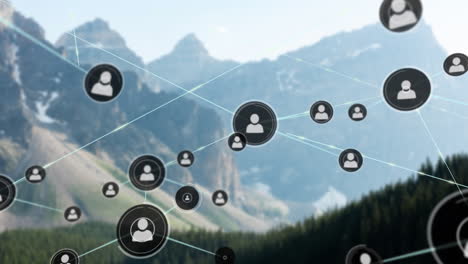 Animation-of-network-of-connections-with-people-icons-over-mountain-landscape