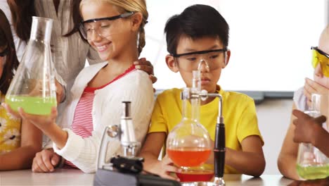 School-kids-doing-a-chemical-experiment-in-laboratory