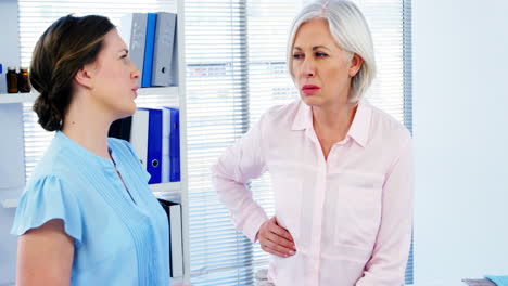 Female-doctor-interacting-with-patient