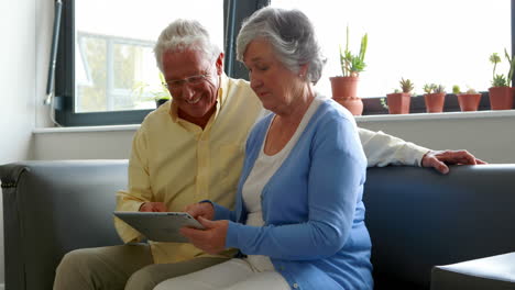 Senior-couple-using-digital-tablet