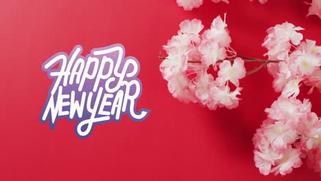 Animation-of-new-year-greetings-text-over-chinese-blossom-on-red-background