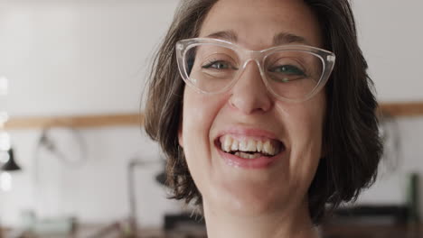 Portrait-of-happy-caucasian-female-worker-with-glasses-in-jewellery-studio-in-slow-motion
