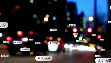 Animation-Von-Social-Media-Symbolen-Auf-Mehreren-Sprechblasen-über-Verschwommener-Sicht-Auf-Den-Nächtlichen-Stadtverkehr