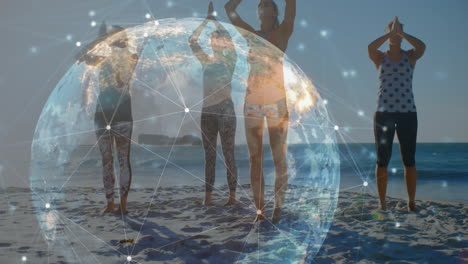 Animation-of-glowing-global-network-over-female-friends-doing-yoga-on-sunny-beach