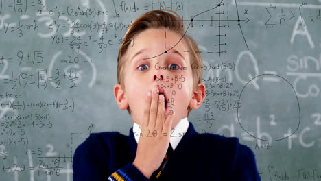 Animation-of-math-formulas-over-scared-caucasian-boy-over-blackboard