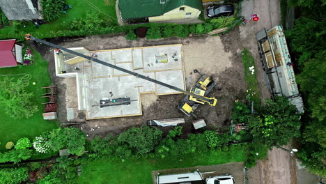 An-Aerial-View-Of-A-Green-Landscape-And-A-Construction-Site-In-A-Neighbourhood