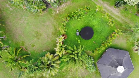 Off-grid-home-viewed-from-above-with-water-tank-and-hexagon-design-home