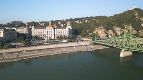 Forward-Drone-Shot-Above-Danube-River-toward-Gellert-Hill,-Liberty-Bridge