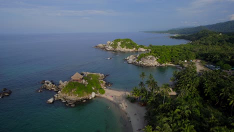 Drone-ascent-revealing-Cabo-de-San-Juan-coastline-in-Tayrona-National-park-of-Colombia