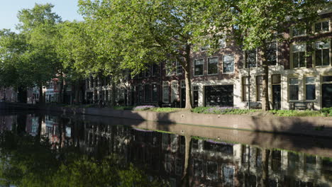 Large-Canals-With-Tree-Reflections-At-Lage-Gouwe-Street,-Gouda-City-Center,-Netherlands