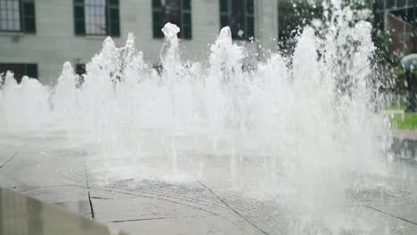 Close-up-of-multiple-fountains-spraying-water-in-a-park-in-Boston,-Massachusetts