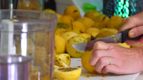 Cutting-passion-fruit-for-processing-in-a-home-kitchen-on-Hawaii