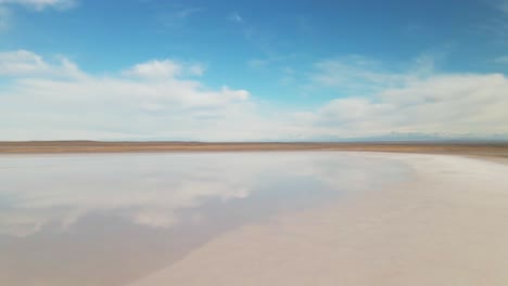 A-saltwater-lagoon-reflecting-the-sky-with-the-Andes-Mountains-in-the-background