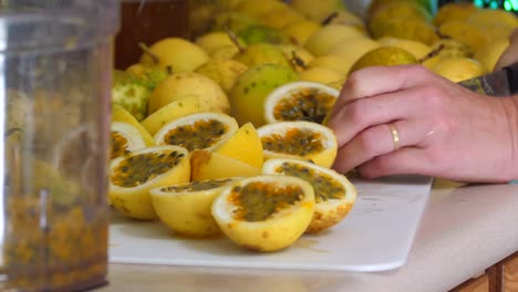 Cutting-lilikoi-passion-fruit-for-processing-in-a-home-kitchen