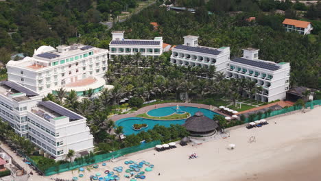 Aerial-over-the-The-Sailing-Bay-Beach-Resort-in-Mui-Ne,-Phan-Thiet,-Vietnam