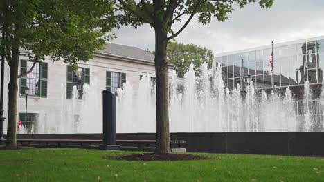 Many-fountains-outside-an-office-building-on-an-overcast-day-in-Boston,-Massachusetts
