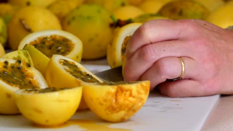 Cutting-Passion-fruit-on-a-chopping-board