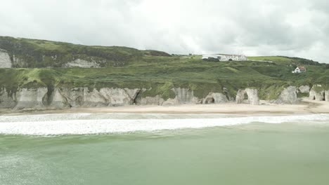 White-Rocks-Beach---Grass-covered-Limestone-Cliffs-And-Sandy-Beach-In-Northern-Ireland-Near-Portrush-Town