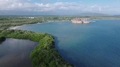 Aerial-view-approaching-Power-Station-Vessels-on-the-sunny-Caribbean-coastline