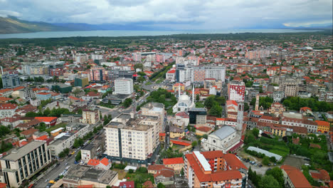High-angle-shot-over-city-buildings-in-Shkodra,-also-known-as-Shkoder-or-Scutari-in-northwestern-Albania