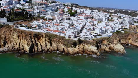 Drone-shot-of-the-cliffy-coast-in-Albufeira,-Portugal