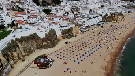 Drone-shot-of-the-beach-town-Albufeira,-right-by-the-beach-you-know