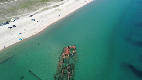 Aerial-Exploration-of-Epanomi-Shipwrecked-Beauty-on-a-Summer-Beach-Day