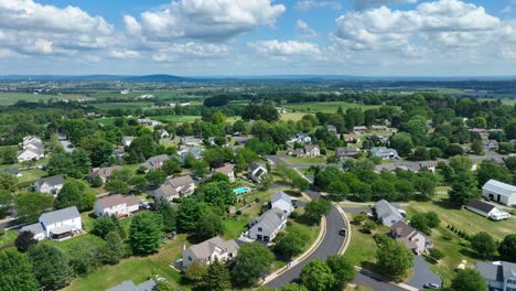 High-aerial-shot-of-American-neighborhood-on-summer-afternoon