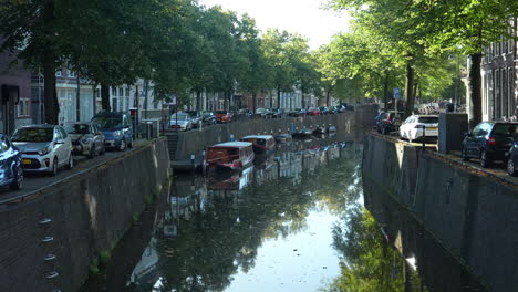 Westhaven-And-Oosthaven-Streets-With-Cars-Parked-Near-Canal-In-The-Old-Town-Of-Gouda,-Netherlands