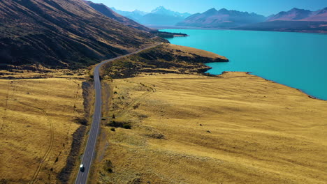 Aerial-view-of-the-stunning-scenic-drive-along-Lake-Pukaki-toward-Mount-Cook-in-the-Southern-Alps,-New-Zealand