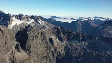 Aerial-drone-view-flying-over-the-epic-mountain-wilderness-of-the-Southern-Alps,-New-Zealand