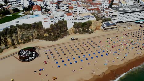 Drone-shot-of-a-large-beach-full-of-pale-fat-brits-