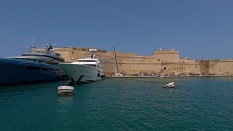 Anchored-Luxury-Ships-At-The-Seaport-Of-The-Walled-City-Of-Valletta-On-The-Mediterranean-Island-Of-Malta,-Europe