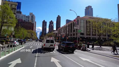 Pov-drive-on-american-road-with-traffic-in-downtown-of-New-York-City-during-sunny-day