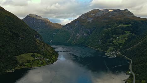 Aerial-over-the-village-of-Gieranger-at-the-head-of-the-Geirangerfjord,-Norway
